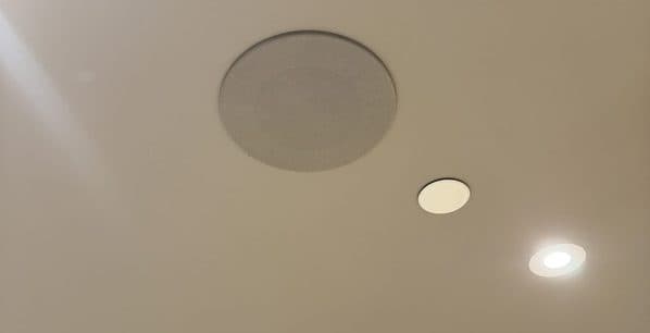 In-ceiling speaker, ceiling sensor and recessed downlight aligned on one line