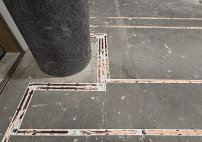 Phased-array copper tape routed around a column